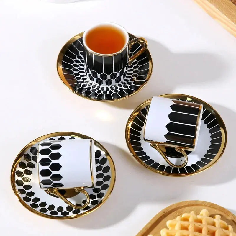 art deco coffee tea cup saucer set with gold handles and black and white art deco style pattern in a gift box 